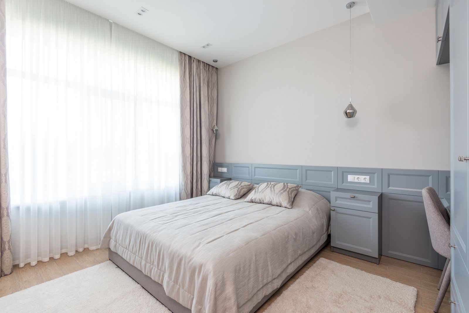 Quiet furnished private bedroom with soft natural light